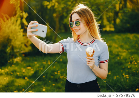 pretty blonde in a park 57579576