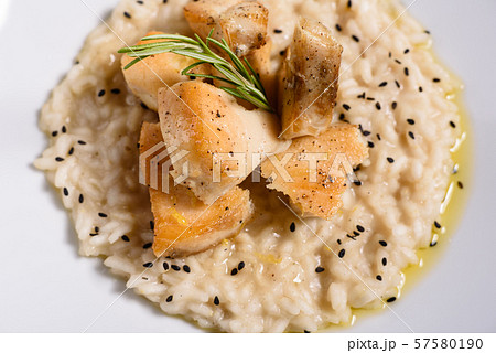 Delicious risotto with pieces of chicken Delicious risotto with pieces of chicken 57580190