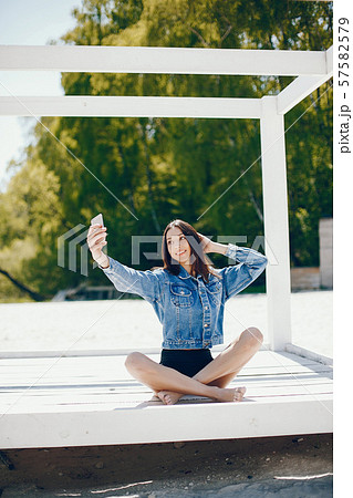 Sunny girl on a beach 57582579