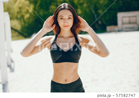Sunny girl on a beach Sunny girl on a beach 57582747