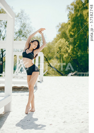 Sport girl on a beach Sport girl on a beach 57582748