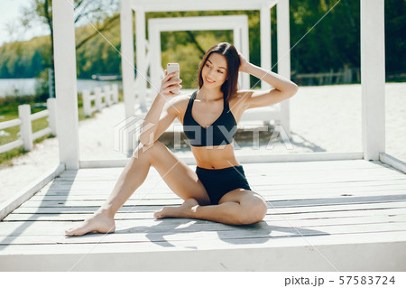 Sunny girl on a beach Sunny girl on a beach 57583724