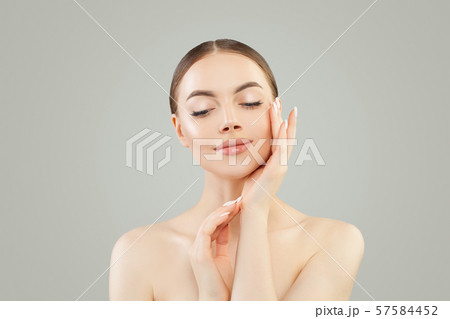 Beautiful woman spa model touching her hands  57584452