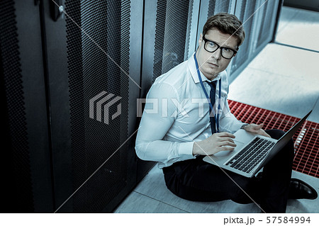 Young detective with a laptop looking involved 57584994