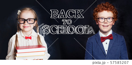 Cute smart kids boy and girl on blackboard Cute smart kids boy and girl on blackboard 57585207