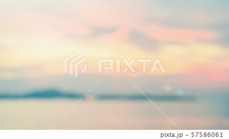 Blur summer background sea sand sun sky bright twilight sunset cloud at golden hour seashore beach Blur summer background sea sand sun sky bright twilight sunset cloud at golden hour seashore beach 57586061