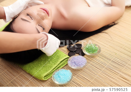 Body care. Spa body massage treatment. Woman having massage in the spa salon Body care. Spa body massage treatment. Woman having massage in the spa salon 57590525