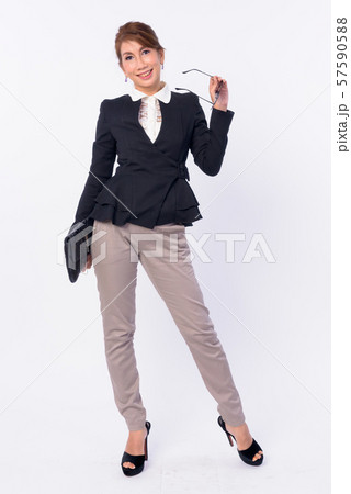 Full body shot of happy mature Asian businesswoman smiling Full body shot of happy mature Asian businesswoman smiling 57590588