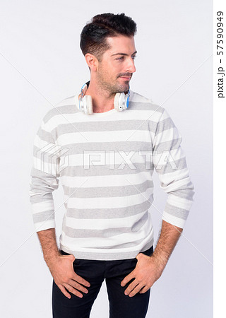 Portrait of handsome bearded man with headphones thinking 57590949