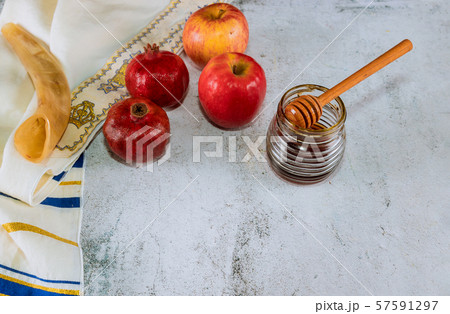 Honey on the pomegranate and apples. Jewish new Honey on the pomegranate and apples. Jewish new 57591297