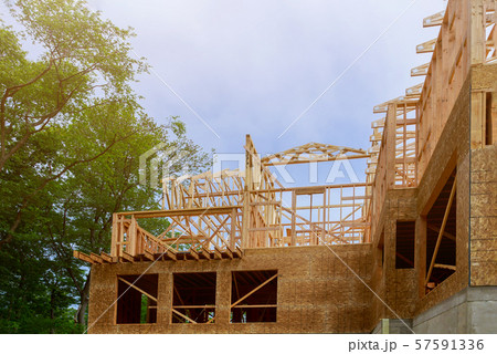 Looking up new construction beams under a clear Looking up new construction beams under a clear 57591336