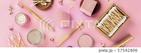 Plastic-free, zero waste cosmetics, panoramic flat lay on a pink background. Bamboo toothbrushes Plastic-free, zero waste cosmetics, panoramic flat lay on a pink background. Bamboo toothbrushes 57592806
