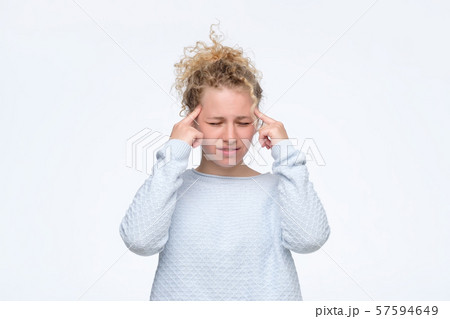 girl tries to remember something in mind or generate idea 57594649