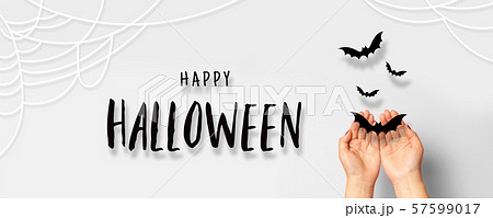 Halloween concept. Female hands with paper black Halloween concept. Female hands with paper black 57599017