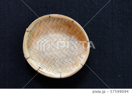 Empty wicker basket on black background 57599094