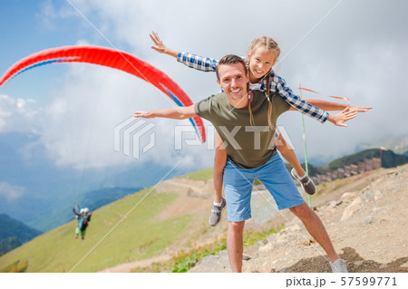 Beautiful happy family in mountains in the background of fog 57599771