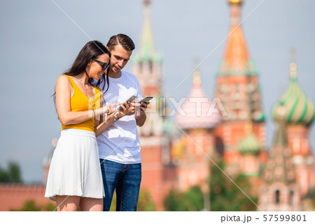 Young dating couple in love walking in city background St Basils Church Young dating couple in love walking in city background St Basils Church 57599801