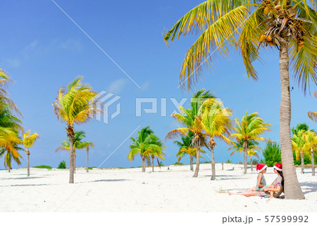 Little cute girl and young mother at tropical beach 57599992