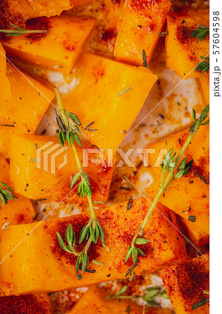 Roasted pumpkin slices with thyme 57604598