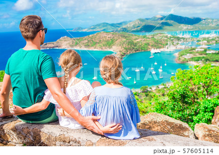 Adorable little kids and young father enjoying the view of picturesque English Harbour at Antigua in Adorable little kids and young father enjoying the view of picturesque English Harbour at Antigua in 57605114