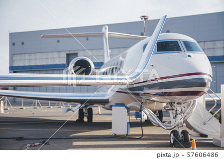 modern and comfortable business jet plane in the afternoon at the airport 57606486