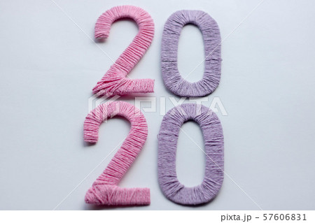 Happy New Year 2020. Creative text Happy New Year 2020 written sparkling sparklers isolated on black Happy New Year 2020. Creative text Happy New Year 2020 written sparkling sparklers isolated on black 57606831