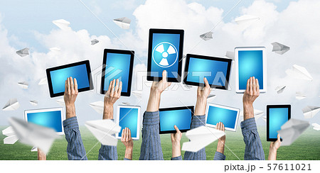Close of businessman hands in line showing tablet pc with blank blue screen 57611021