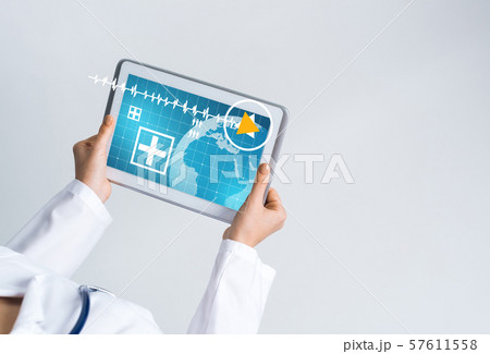 Close of female doctor hands working with tablet pc computer Close of female doctor hands working with tablet pc computer 57611558