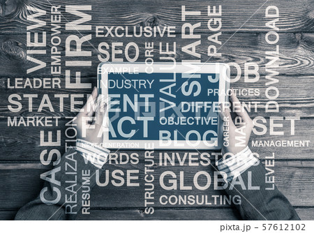 Hands of businesswoman using tablet pc and business conceptual words 57612102