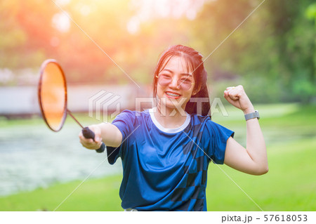Sport girl teen play badminton outdoor exercise Sport girl teen play badminton outdoor exercise 57618053
