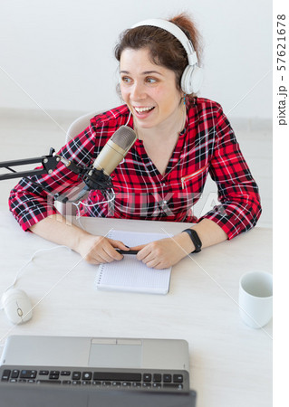 Radio, blogging, podcasting concept - young woman presenter on the radio Radio, blogging, podcasting concept - young woman presenter on the radio 57621678
