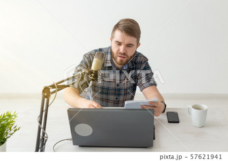 Podcasting, music and radio concept - young dj at radio studio 57621941