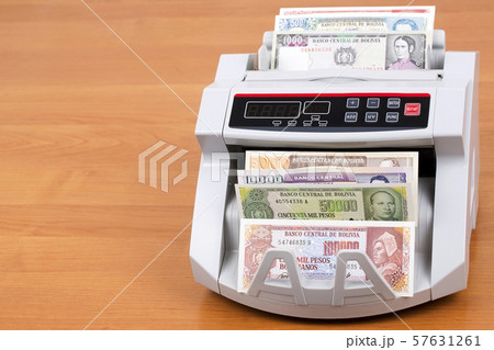 Old Bolivian Boliviano in a counting machine 57631261