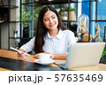 Asian woman in cafe 57635469