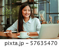 Asian woman in cafe 57635470