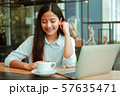 Asian woman in cafe 57635471
