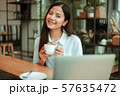 Asian woman in cafe 57635472