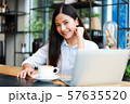Asian woman in cafe 57635520