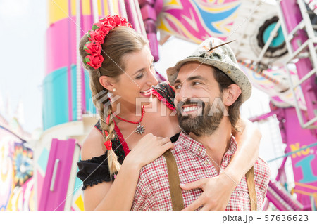 Man and woman in Tracht on the Oktoberfest in Munich 57636623