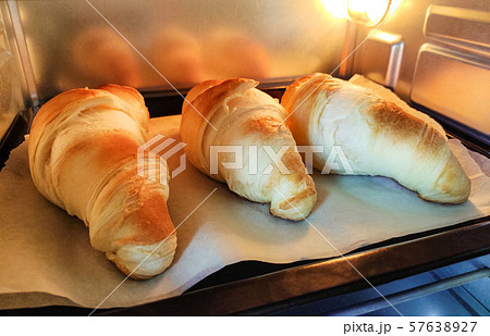 Croissants are cooked in the oven. Baking for breakfast. 57638927