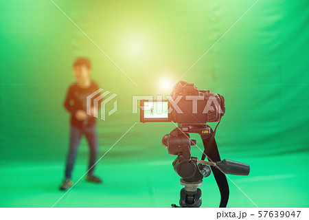 Videographer taking video camera, camera equipment Videographer taking video camera, camera equipment 57639047