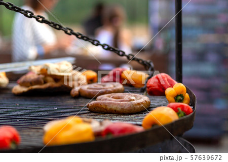 A large round grill on the coals in which grilled A large round grill on the coals in which grilled 57639672