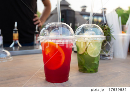 A counter with multi-colored fruit cocktails in 57639685