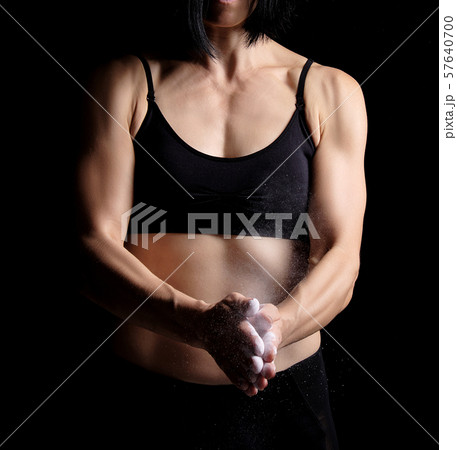 girl with a sports figure dressed in a black top girl with a sports figure dressed in a black top 57640700