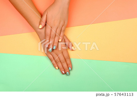 Manicure in trendy colors. 57643113