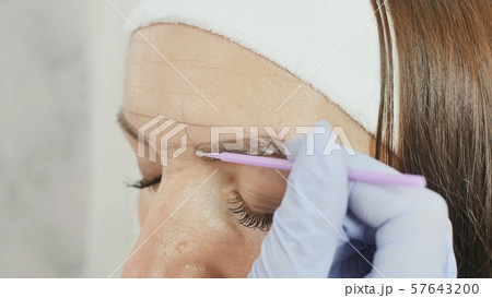 Application of anesthesia cream. Permanent makeup. Permanent tattooing of eyebrows. 57643200