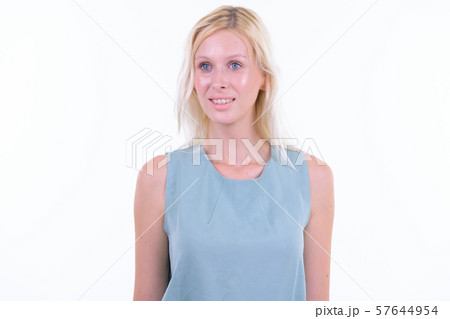 Portrait of happy young beautiful blonde woman thinking 57644954