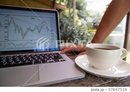Trader man drink black coffee and pointing tactical move, strategy analysis of stock graph Trader man drink black coffee and pointing tactical move, strategy analysis of stock graph 57647519