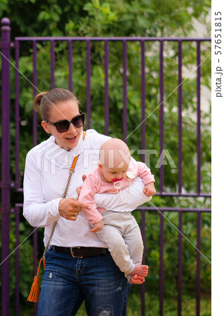 Young mother with children on playground Young mother with children on playground 57651815