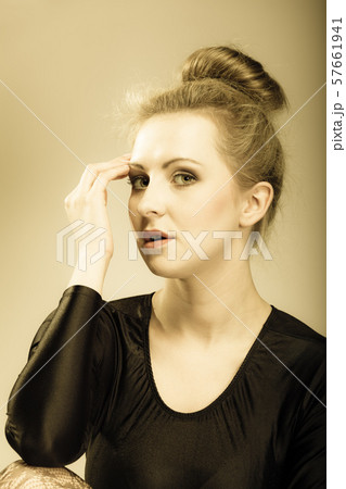 girl blonde woman in hair bun 57661941